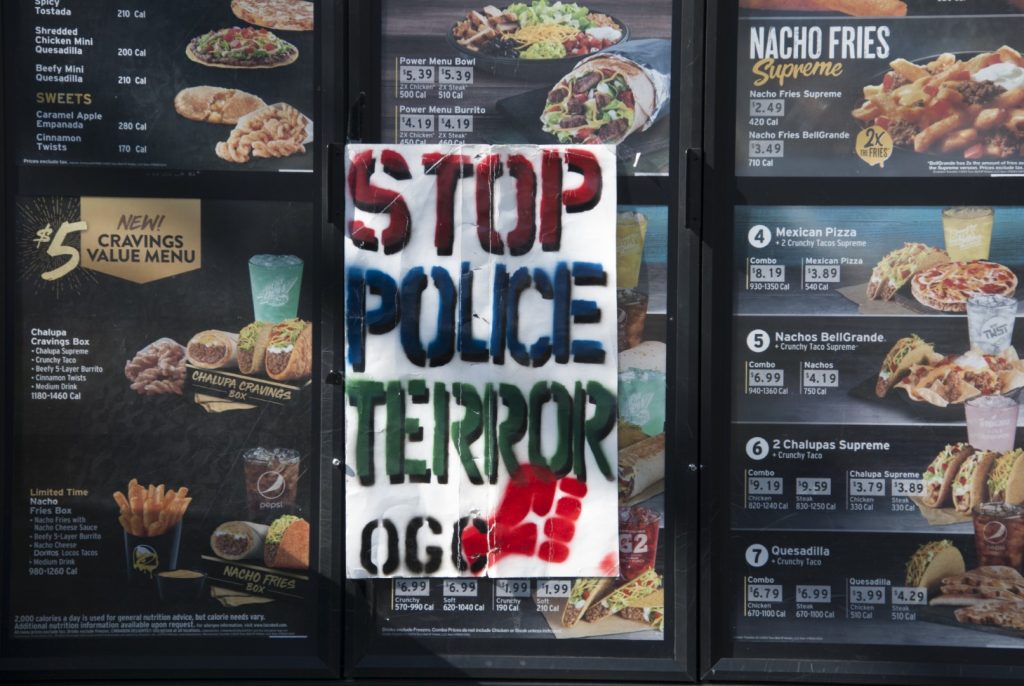 A sign hung on the drive-through menu of a Taco Bell in Vallejo after rapper Willie McCoy was shot by officers there on Feb. 9. Photo: Scott Morris